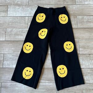 Dressed in la la smiley sweater pants